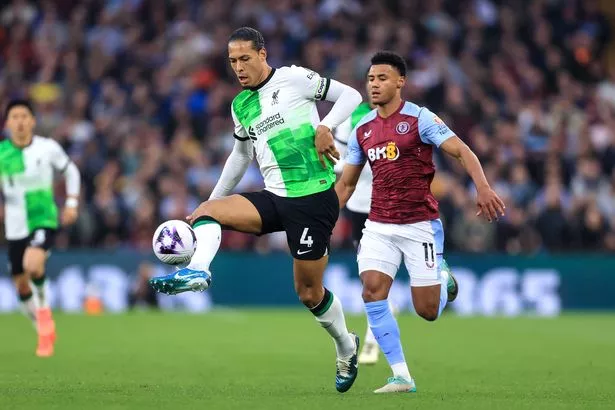 Virgil van Dijk of Liverpool and Ollie Watkins of Aston Villa