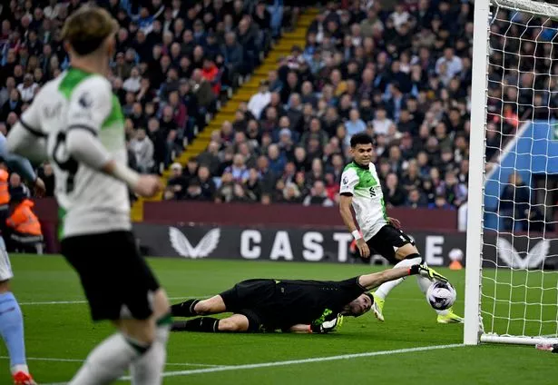 Emiliano Martinez of Aston Villa fumbling the ball over the line for an own goal